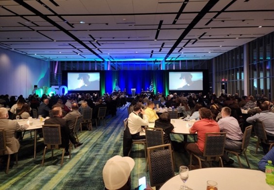 Group of people at a conference sitting at tables
