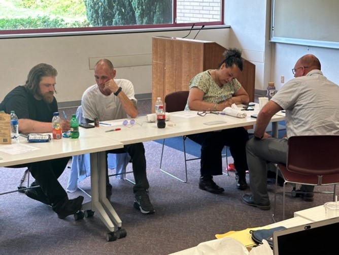 People sitting at a table working on an activity